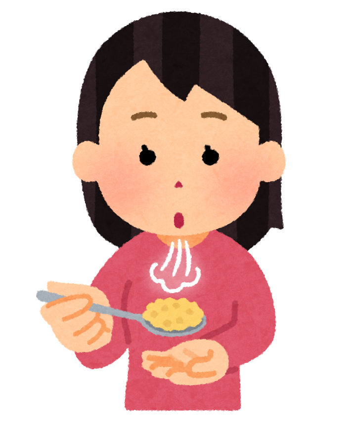 食事を冷まして食べようとする女性
